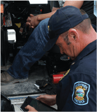 Highway patrol Officer inspecting cargo on truck
